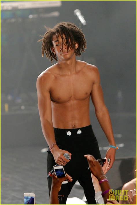 Jaden Smith showcases his rock hard abs as he goes shirtless .